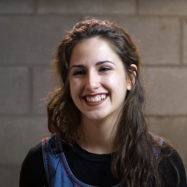 A photo of artist Natasha Banks smiling.